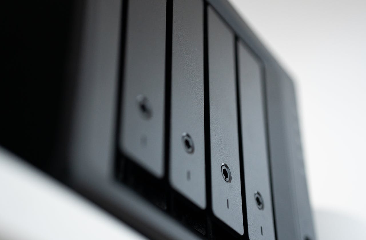 hero-img-01 Detailed view of a black data storage unit highlighting modern technology and data management.